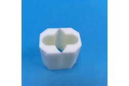 Small vacuum cast plastic component with two circular openings